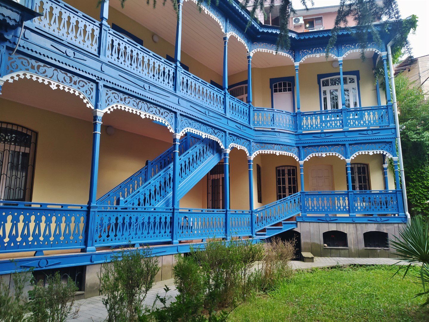 Traditional wooden gallery on Baratashvili Street, Borjomi