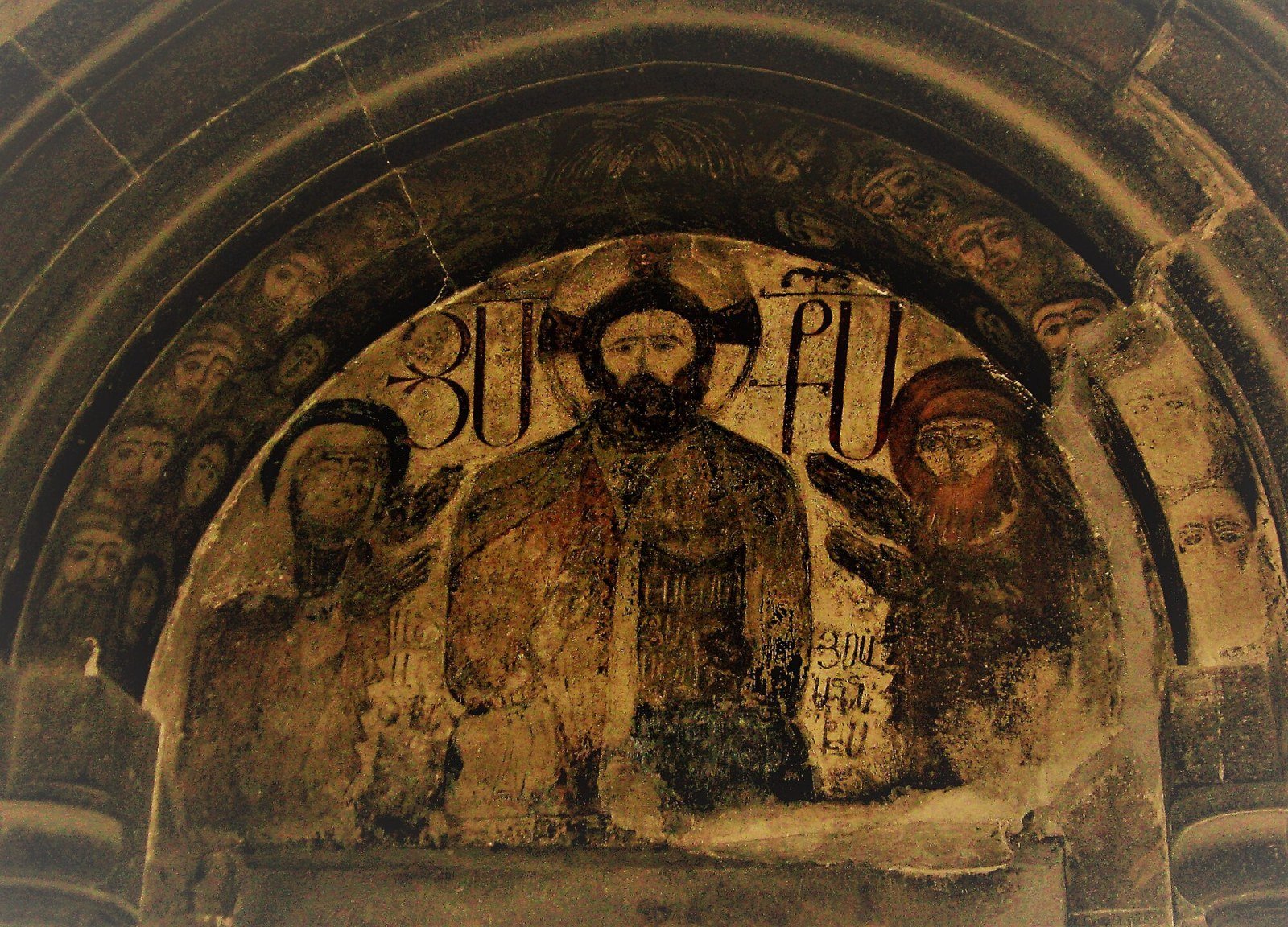 Exterior view of Kecharis Monastery among fir trees, Tsaghkadzor