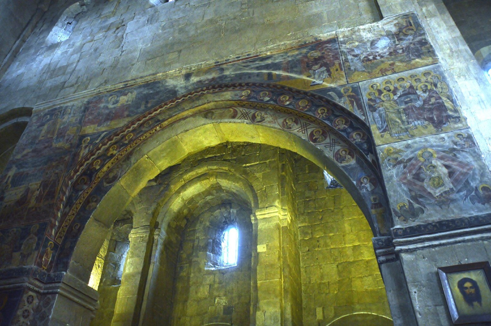 Medieval frescoes on arches and pillars of the central nave of Sveti Tskhoveli
